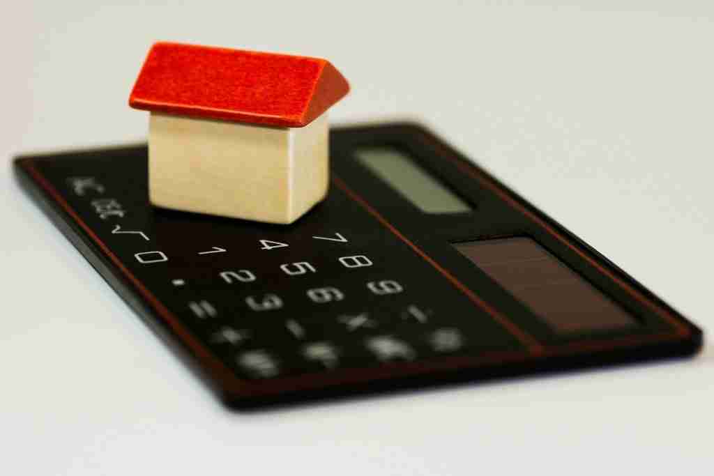 image of calculator to represent the cost of buying a house in 2021